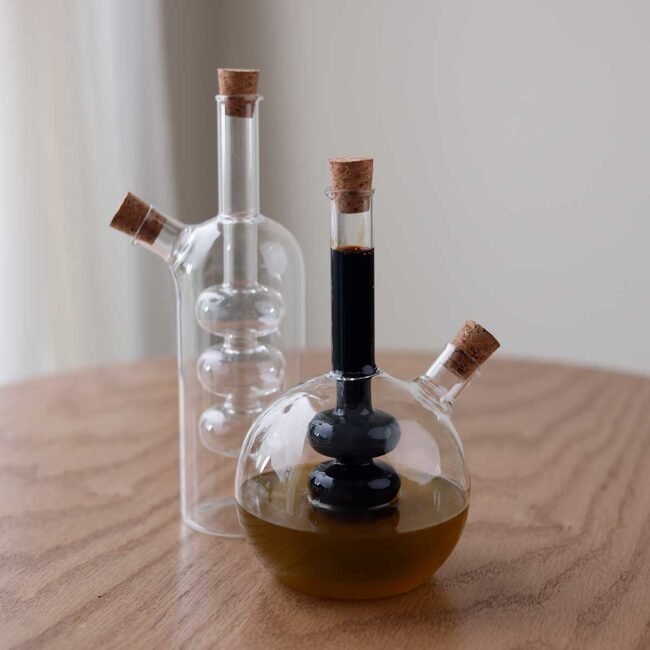 Compact Cylindrical Liquid Bottle with Screw Design - Image 2