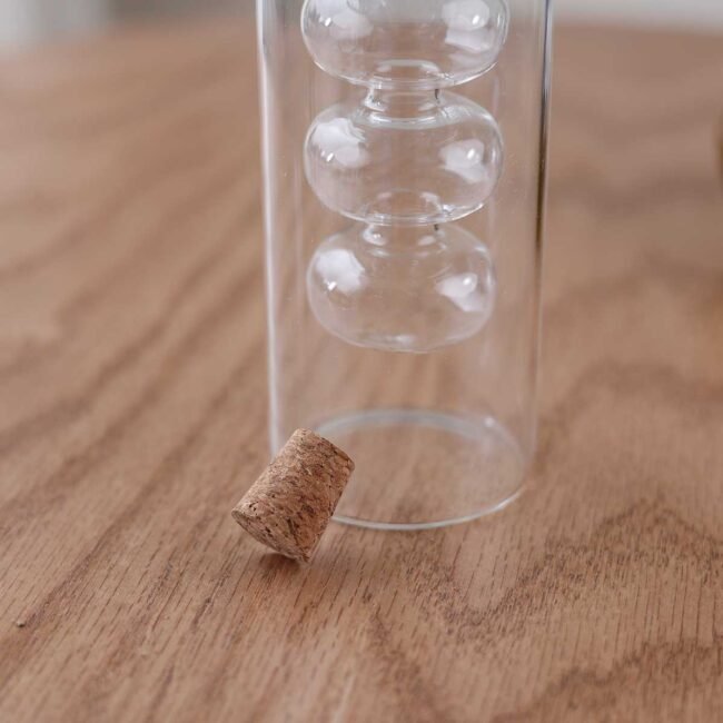 Compact Cylindrical Liquid Bottle with Screw Design - Image 3