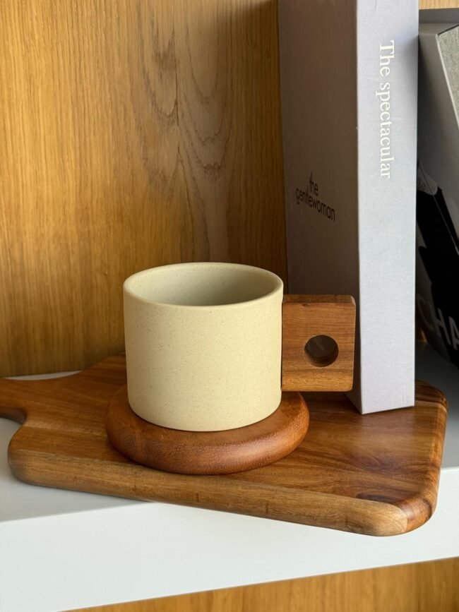 Ceramic mug with wooden coaster